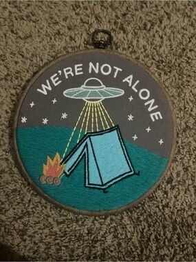 Ashland Teal, Light Blue and Yellow Embroidered 'We're Not Alone' Hoop Art
